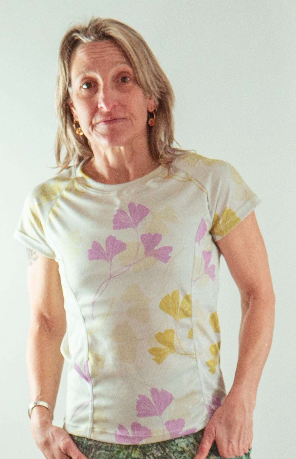 Moxie Tee jersey in moss floral print with performance fabric and moisture management technology.